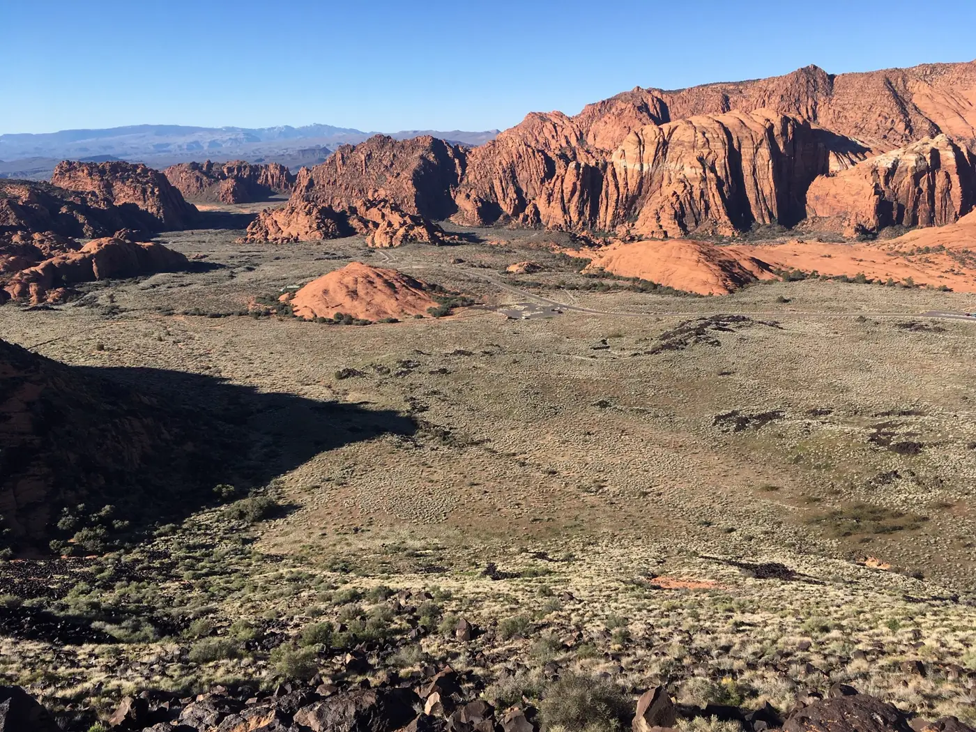 Red sandstone cliffs and desert scrub in the valley of Snow Canyon State Park near St. George